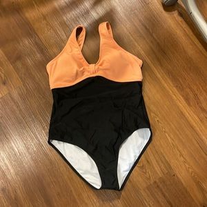 Peach and black one piece. Absolutely stunning